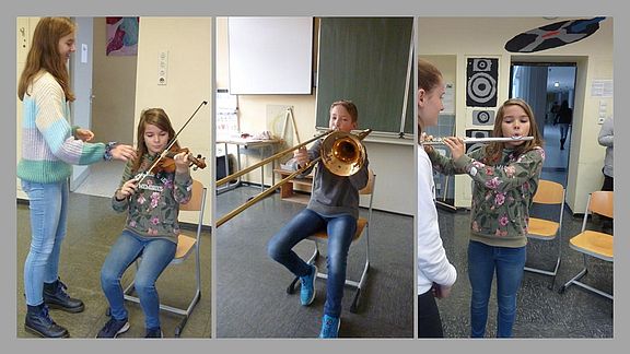 Schüler probieren Instrumente aus 